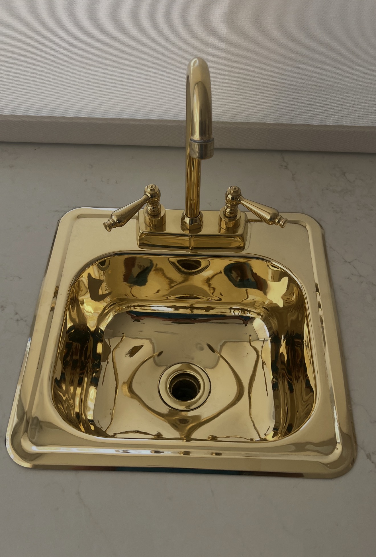 Copper and brass bar sink polished to a mirror finish after restoration in the Coachella Valley