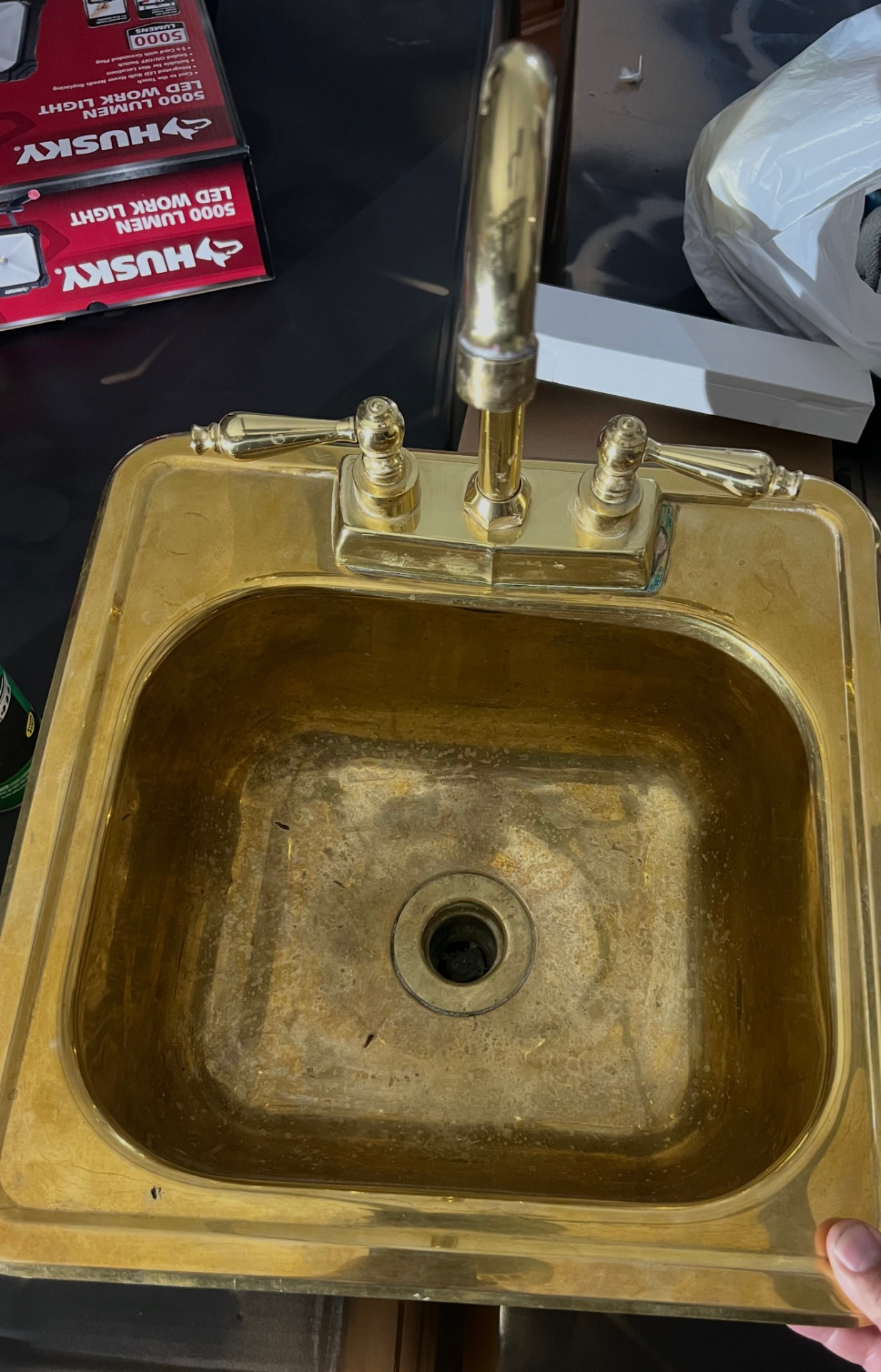 Heavily tarnished brass bar sink before on-site restoration in Indio, California